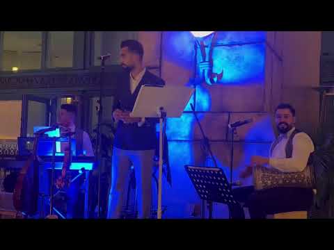 Singing with the trio band 🎙️