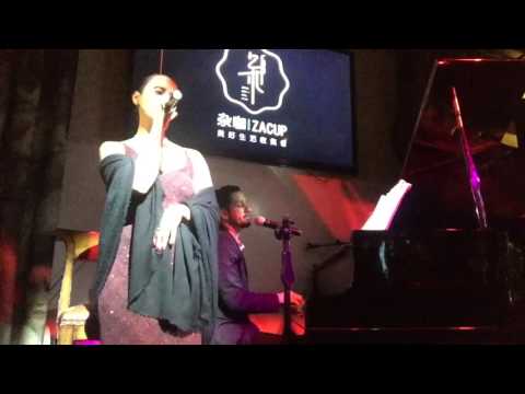 Entice performing a live acoustic piano and vocal cover of What's up