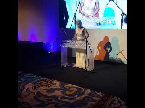 Playing harp glass on event.