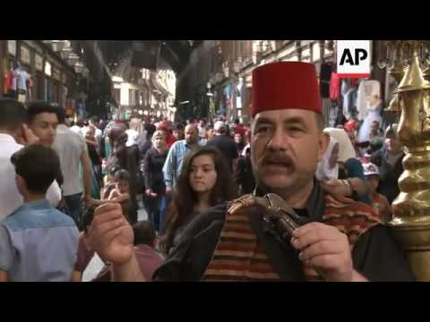 Traditional drink served with folkloric songs in Damascus souk